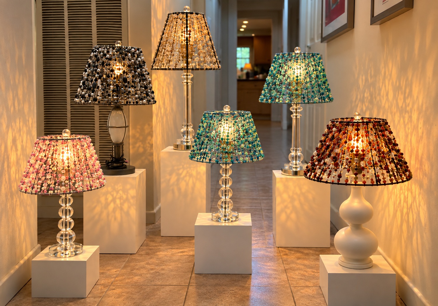 A hallway lineup of Lauri Rosen's original finished Beaded Lights