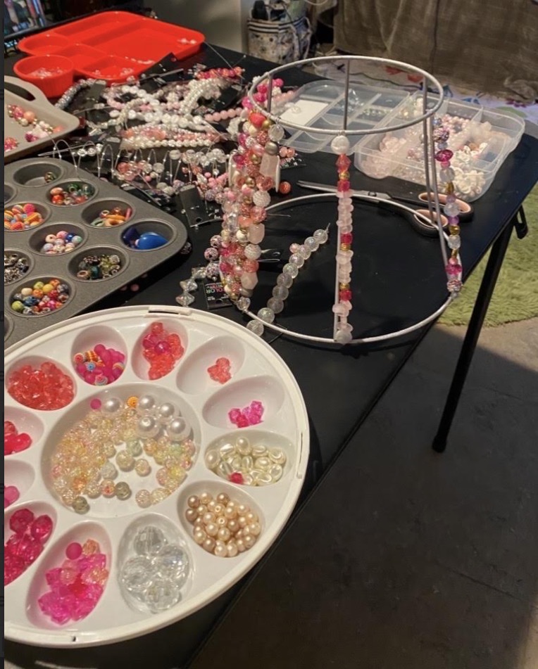 Pink bead palette and shade frame in progress on The Beaded Light worktable
