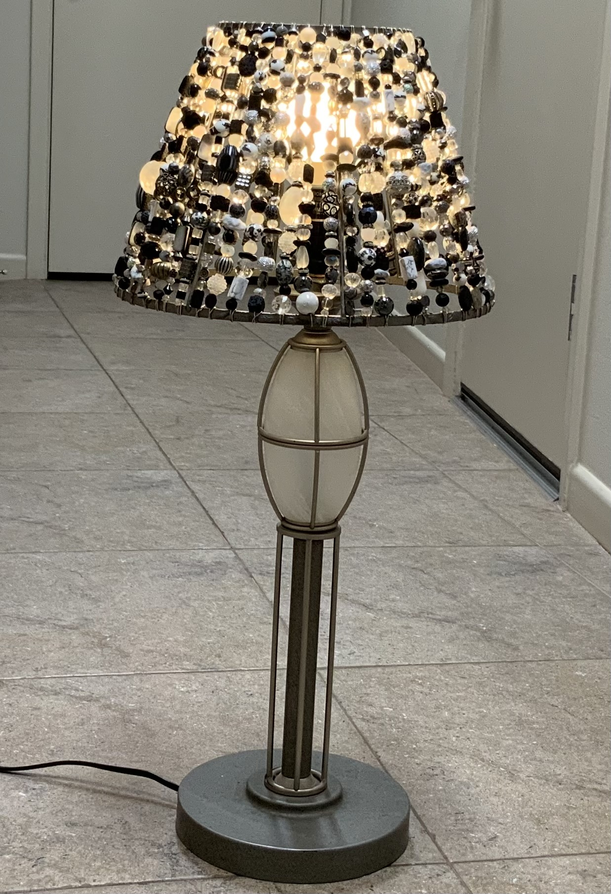 Completed black white and silver Beaded Light on its full lamp base